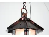 Wyrób kuty: Wisząca Lampa Kowalska z Ornamentem Liściastym